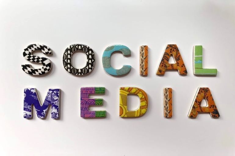 multi-colored letters spelling 'social media' against a white background